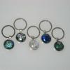 Key Chains:
Fused dichroic glass cabochons decorate these base metal key chains. $20 each
