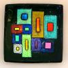 GEOMETRIC EXTROVERT # 105:
Fused and slumped black sushi dish with dichroic onlay.  Measures 6.5 inches square.  $165