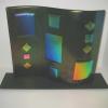 GEOMETRIC S-CURVE:
Fused and slumped glass S-Curve with dichroic onlay.  Displayed in custom black metal stand. Measues 16Lx13H. $450  SOLD.