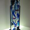 BLUE CONFETTI TOWER:
Kiln formed glass tower, cold worked, sand-blasted.  Displayed in custom  black metal stand. Measures 24Hx5.5Lx1.5W. Contact me for pricing.