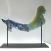 New World Mermaid:  MARTINA.

 Kiln cast glass sculpture.  Cold worked and sand blasted.  Measures 19Lx10Hx2W.  Displayed in custom black metal stand.  SOLD