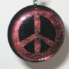 Peace Sign Pendant:
Fused glass pendant with root beer colored border and peace sign. Measures 1.75 inches round. $30