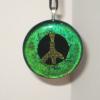 Peace Sign Pendant:
Fused glass pendant with green border and yellow/green peace sign.  Measures 2 inches round. $35