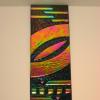 FIRE STICK 
Fused glass art with dichroic onlay. Wall mounted via stand-off bracket system that is easy to install.  Hangs vertically. Measures 6Hx4L. SOLD