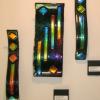 WAVE FIRESTICKS #105,103,104:
Fused S-Curve glass art with dichroic onlay. Wall mounted via stand-off bracket system that is easy to install. #105 and #104 measure 2Wx15L. #103 measures 5.5Wx15L. $225 for #104, $225 for #105,  #103 SOLD.